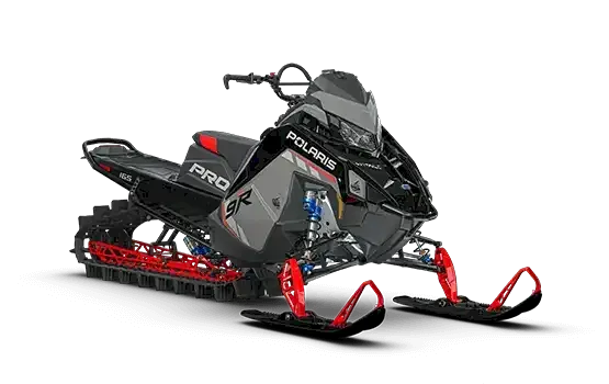 Gray and black Polaris RMK SP mountain snowmobile with red rails