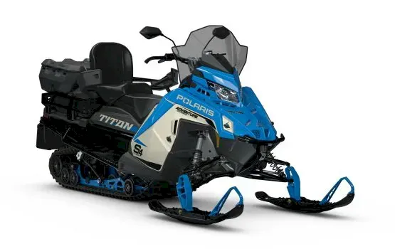 Blue and white Polaris TITAN Adventure Ultimate snowmobile with passenger seat and cargo box