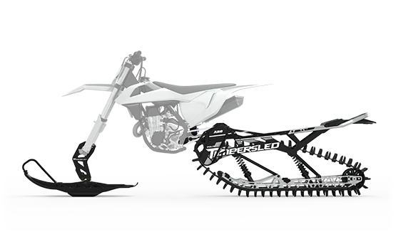 White dirt bike with a black and white Timbersled ARO kit showing the track system