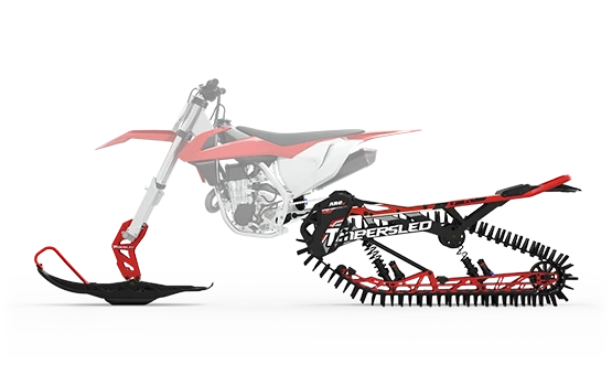 Red and white dirt bike featuring a matching red Timbersled ARO 129 snow kit