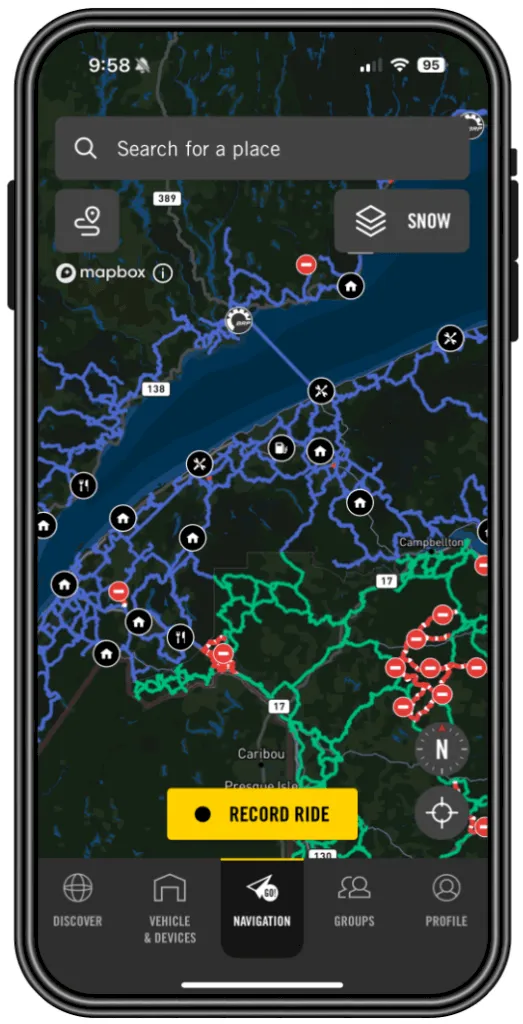 Smartphone screen displaying a dark map interface with blue and green trail routes and a yellow Record Ride button