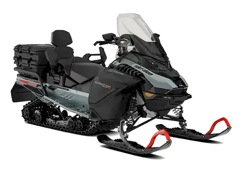 Black and dark grey Expedition snowmobile with red ski loops, rear cargo box, and passenger seat on a white background